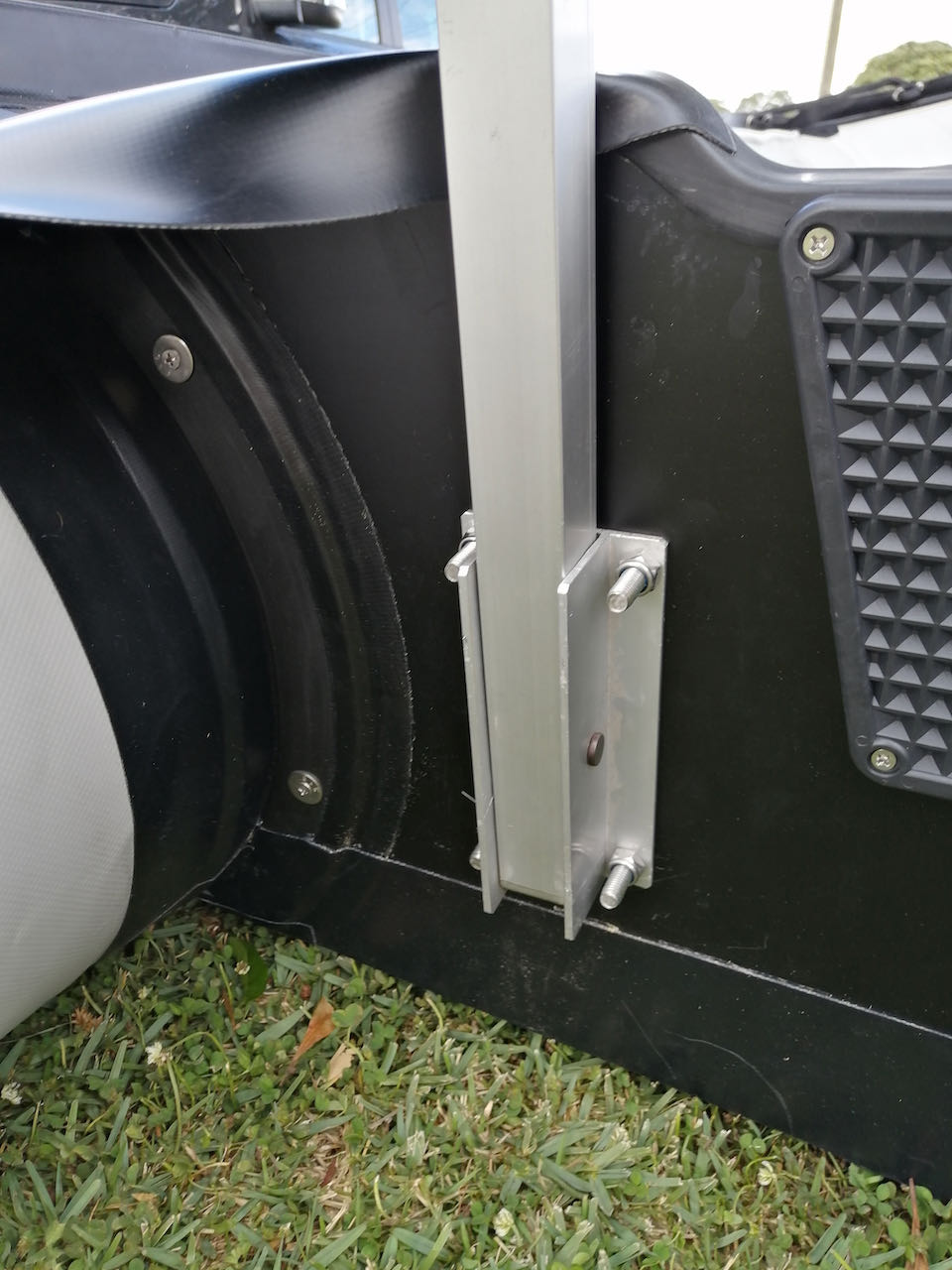 Boat launching wheels (heavy duty) attached to the boat's transom with four stainless steel bolts and nuts.
