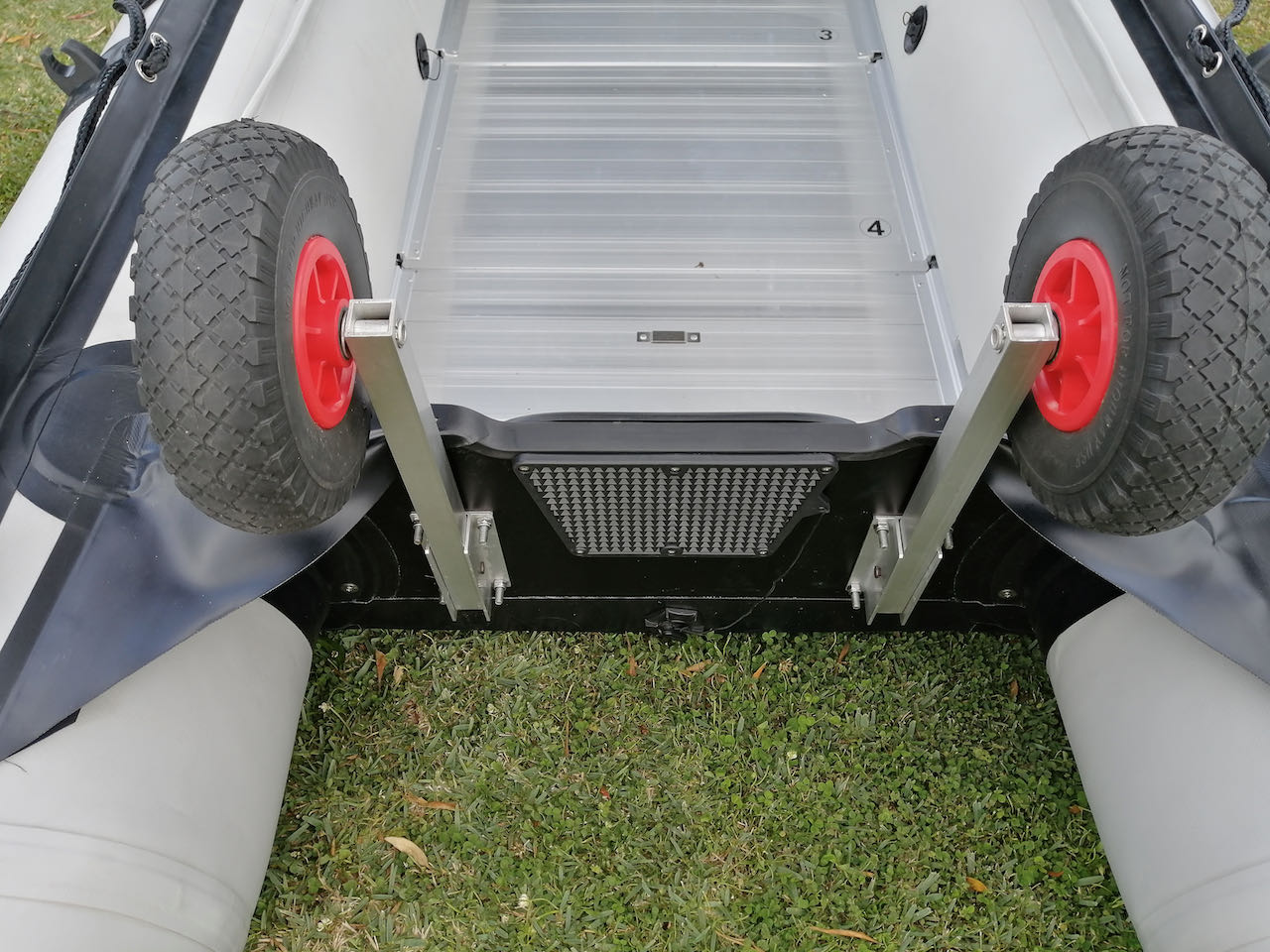 Boat launching wheels (heavy duty) in flipped up position, view from rear top of transom.